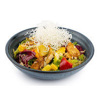 Chicken salad with pineapples, fried rice noodles and almond shavings in Thai sauce